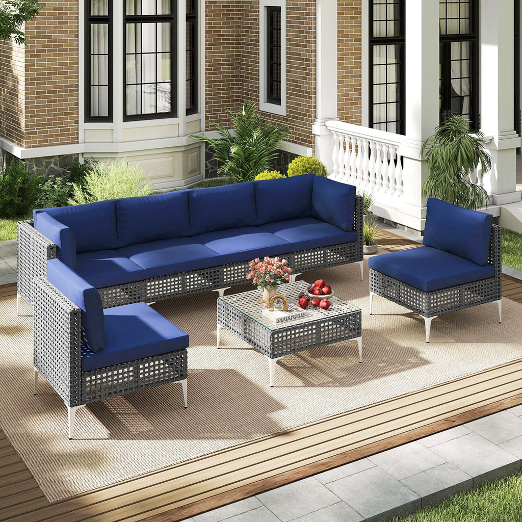 7-Piece PE Rattan Patio Furniture Set with Navy Cushions and Glass Coffee Table