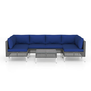 7-Piece PE Rattan Patio Furniture Set with Navy Cushions and Glass Coffee Table