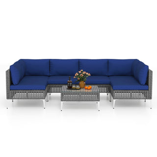 7-Piece PE Rattan Patio Furniture Set with Navy Cushions and Glass Coffee Table