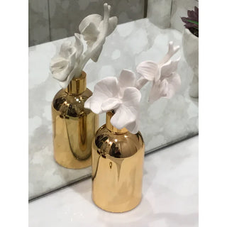 Gold Bottle Diffuser with Gold Cap and White Flower,