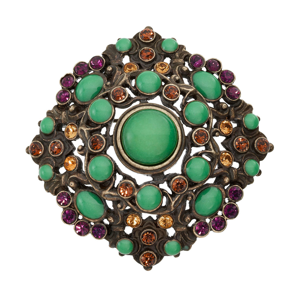 Bronze Brooch with Green Jewels