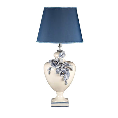 This bespoke ceramic design by Antonio Fullin distills a sense of grace in impeccable classic style made fresh and romantic by the choice of a fresh color palette and detailed peonies adorning the bulging body. Superb on a nightstand or console in classic or contemporary decors for an eclectic touch, it is completed by a square-cut base and conical blue lampshade.