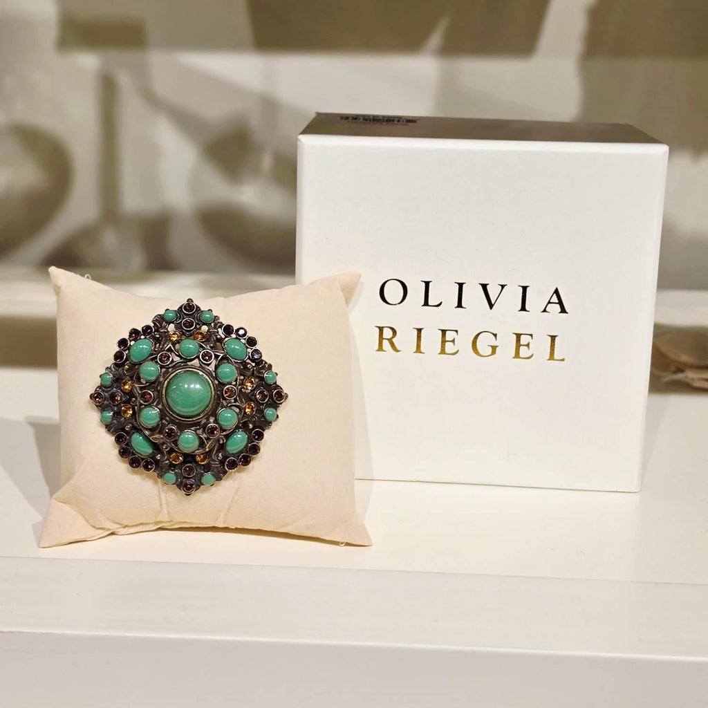 Bronze Brooch with Green Jewels