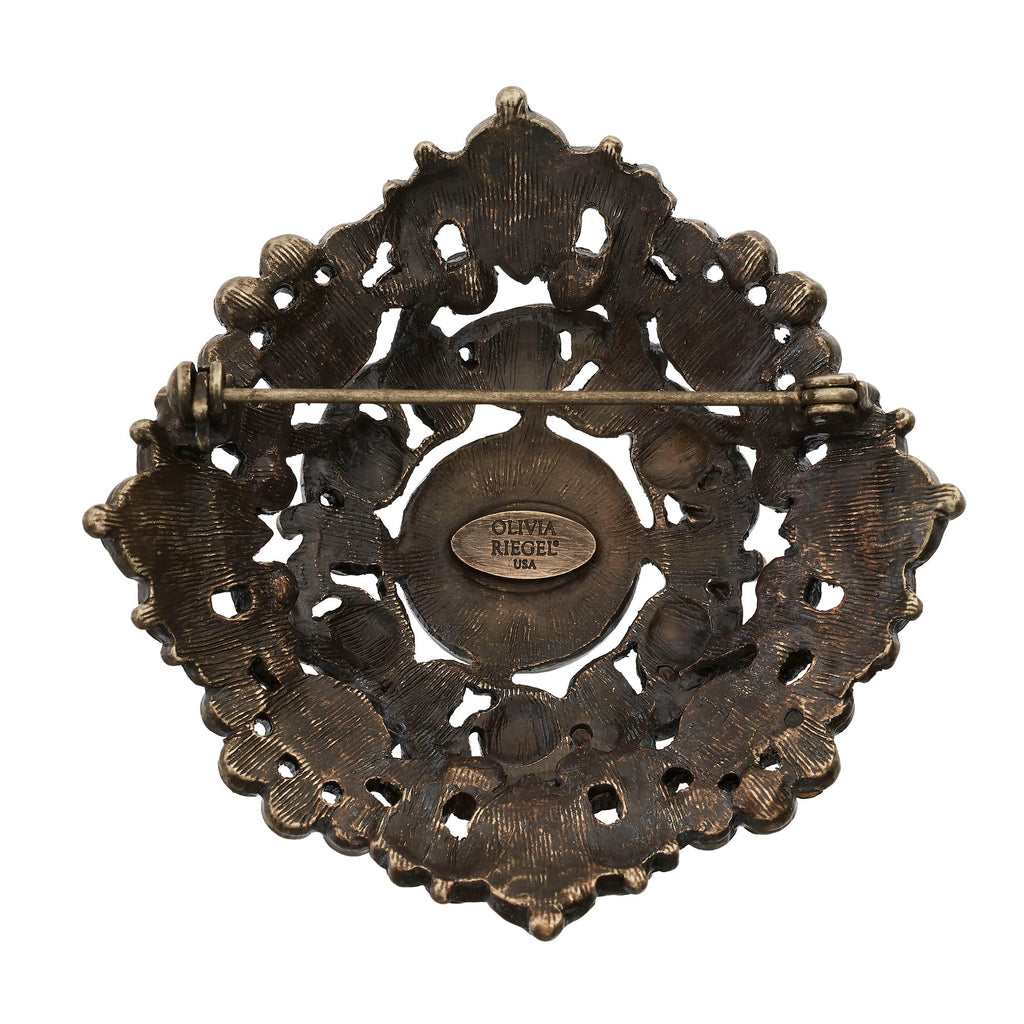 Bronze Brooch with Green Jewels