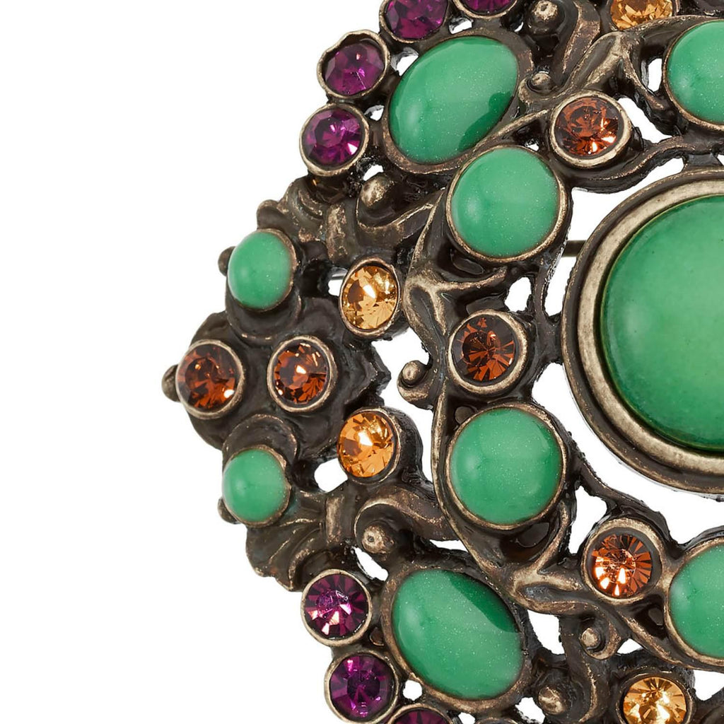 Bronze Brooch with Green Jewels