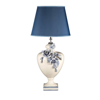 This bespoke ceramic design by Antonio Fullin distills a sense of grace in impeccable classic style made fresh and romantic by the choice of a fresh color palette and detailed peonies adorning the bulging body. Superb on a nightstand or console in classic or contemporary decors for an eclectic touch, it is completed by a square-cut base and conical blue lampshade.